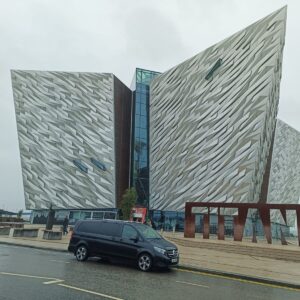 Luxury chauffeur van parked outside Titanic Belfast museum